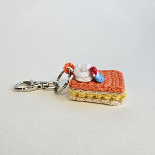 Mini oranje tompouce sleutelhanger