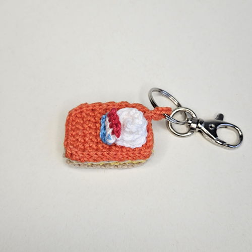 Mini oranje tompouce sleutelhanger